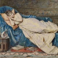 A young lady reclining on a chaise longue